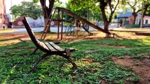 Old park bench in warm sunlight asuncion paraguay 4k 24fps 스톡 동영상 319312801