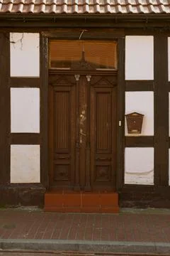 Old, partly damaged and rustic door . old front doors Stock Photos