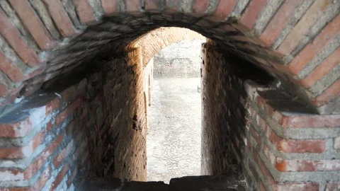 Old passage between red brick walls Stock Footage 106028991