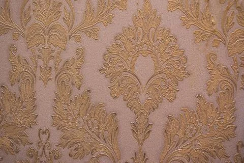 Old patterns on the wall. Old wallpaper. Home decoration. Stock Photos