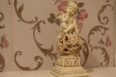 Old patterns on the wall. Old wallpaper. Home decoration. Stock Photos