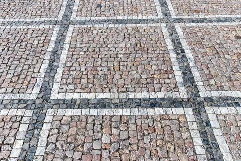 Old pavement of granite texture. Stock Photos