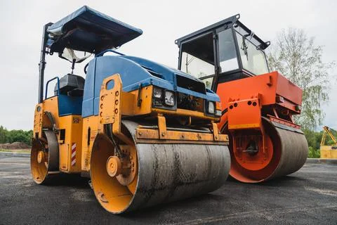 Old paver close-up. Road roller. Road construction concept Stock Photos
