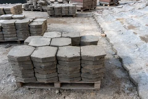 Old paving slabs in close-up. Storage of paving slabs during the repair of ro Stock Photos