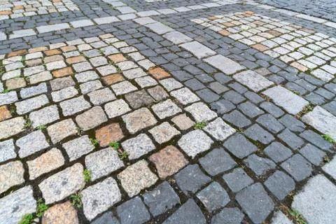 Old paving stones pattern. Texture of ancient german cobblestone in city down Foto stock