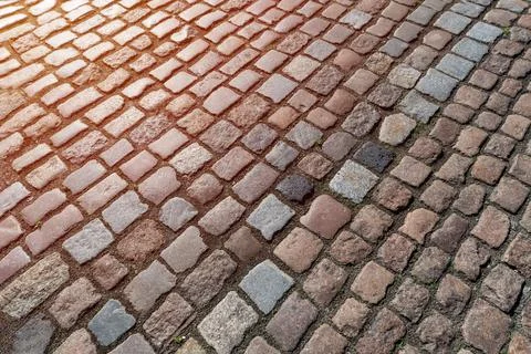 Old paving stones pattern. Texture of ancient german cobblestone in city down Foto stock