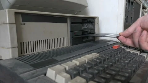 Old pc. The inserting and removing an old-style 5.25" floppy disk Stock Footage 91374010