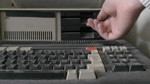 Old pc look. View of a close-up of removing an old-style 5.25 Inch Floppy disk Stock Footage 91299730