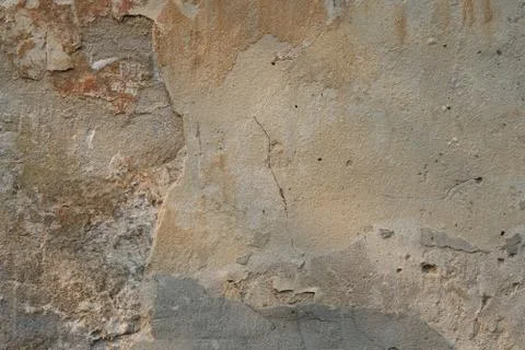 Old peeled cement wall background. Stucco texture on the wall. Stock Photos