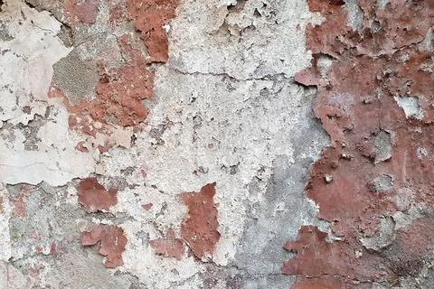 Old peeling plaster texture. White gray brown cement wall. Damaged texture Foto stock