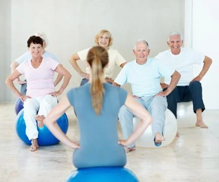 Old people, stretching or instructor in yoga class, fitness or exercise tog.. Stock Photos