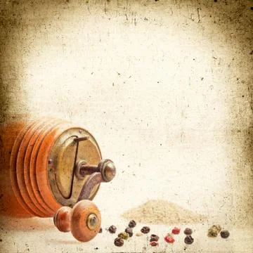 Old pepper grinder mill with different dried peppers Stock Photos
