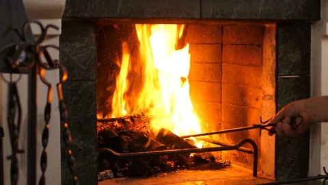 Old person using fireside iron tool set. Fireplace tools sets in the attic. Isol Stock Footage 123620506