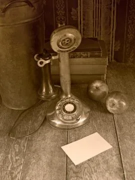 Old phone and a blank note Stock Photos