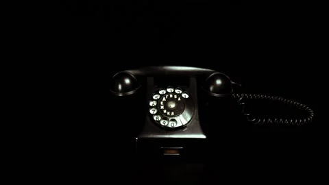Old phone on the black table Stock Footage 99300105
