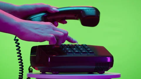 Old phone close-up, retro wired telephone on chroma key green background. Stock Footage 168992832