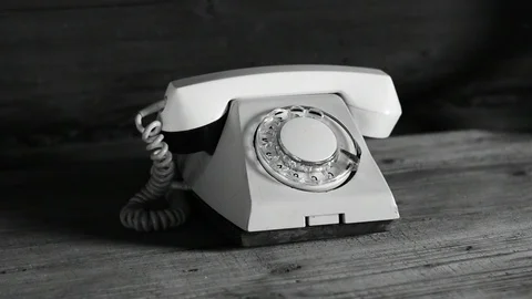 Old phone on the table black and white Stock Footage 112918521