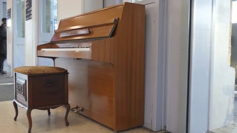 An old piano inside a station. Stock Footage 84129871