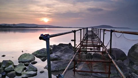 Old pier in sea at sunset 스톡 동영상 72747611