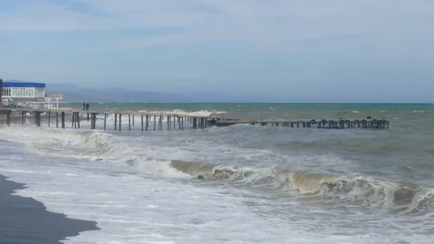 Old pier in stormy sea Stock Footage 80429114