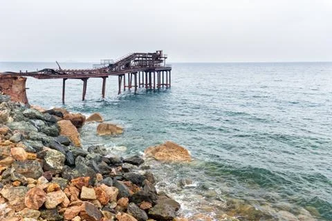 Old pier in the waves Stock Photos