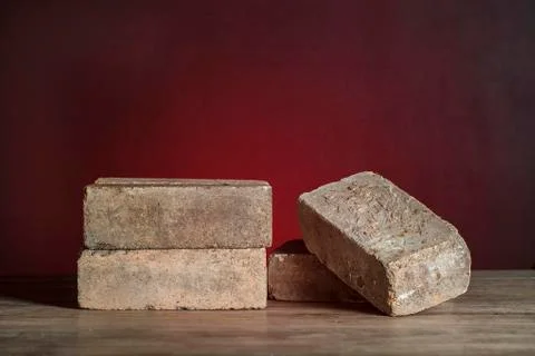 Old pile brick on red background (still life) Stock Photos