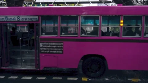 Old pink bus driving by in slow motion Stock Footage 81620574