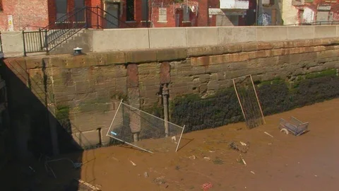 Old pipe off wharf wall on St. Andrews’s Quay, next to river Humber. Hull, UK Stock Footage 103290698