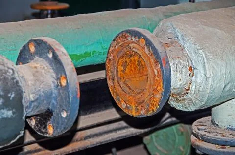 Old pipeline in basement Stock Photos