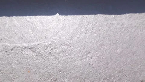 Old plaster, plastered gray wall. Old wall covered with white plaster. Stock Footage 313224298
