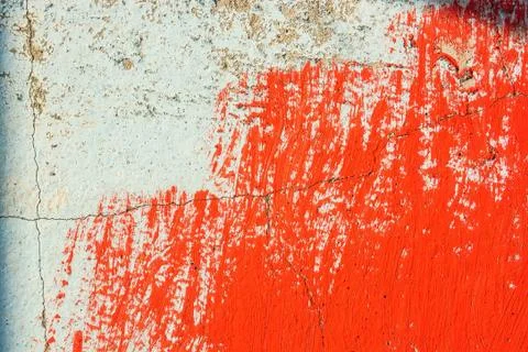 Old plaster wall partly covered in red paint Stock Photos