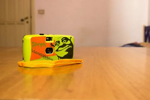 Old plastic kid roll camera with Shrek face Foto stock