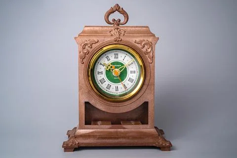 Old plastic table clock from the USSR with gold stopped hands. Brown vintage Stock Photos