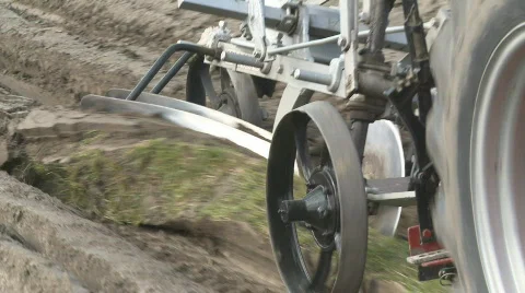 Old plough at end of a row Stock Footage 859242