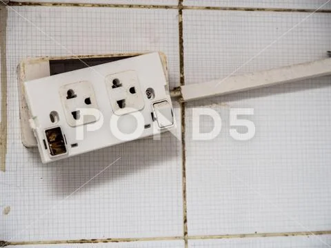 Old plug and The deterioration of the power switch makes it dangerous to use. Stock Photos