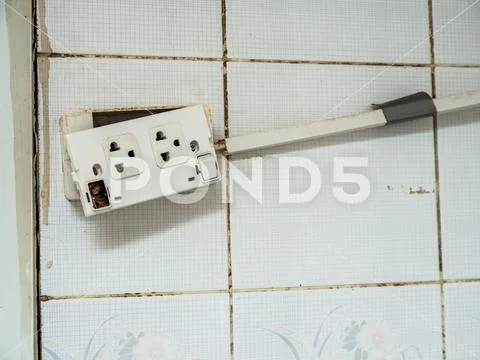 Old plug and The deterioration of the power switch makes it dangerous to use. Stock Photos
