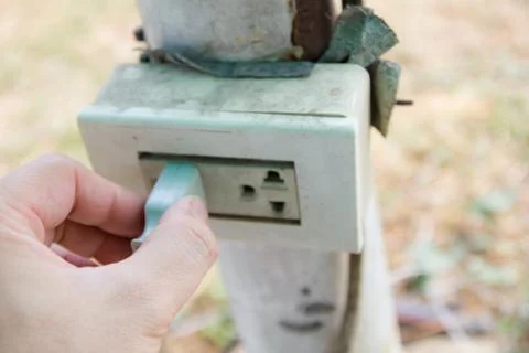 Old plugging in appliance to electrical Stock Photos