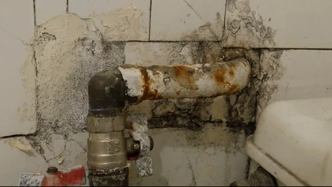 Old plumbing In bathroom Stock Footage 126768390