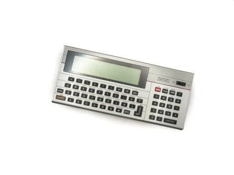 Old pocket computer from the 80s, old technology, mini pc. A silver calculator Foto stock
