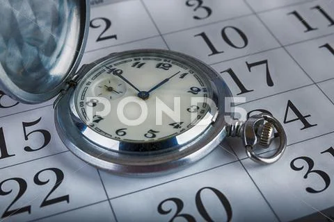 Old pocket watch and calendar Stock Photos