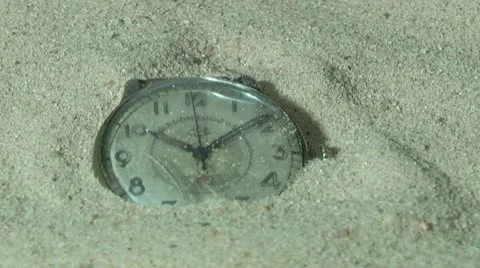 Old pocket watch in the sand Stock Footage 10743656