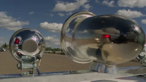 Old police car siren during a chase, rotating and blinking during the day. Stock Footage