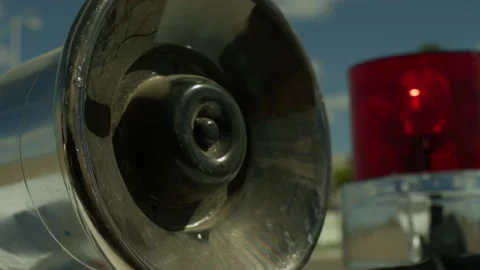 Old police car siren during a chase, rotating and blinking during the day. Stock Footage