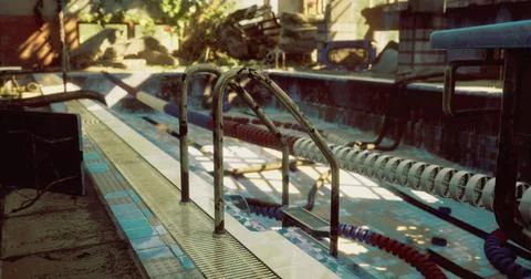 Old pool with rusty railings and faded tiles in a deserted outdoor area Stock Illustration