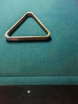Old pool table with triangle. Stock Photos