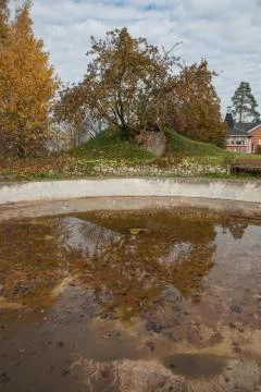 Old pool in the yard during the day Stock Photos