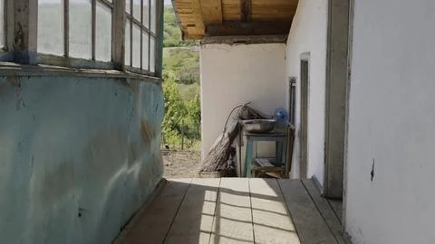 Old porch . Dramatic window shadows on a weathered, rustic wooden deck Foto stock