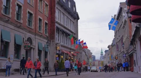 Old Port Montreal People Walking Street Flags Stock Footage