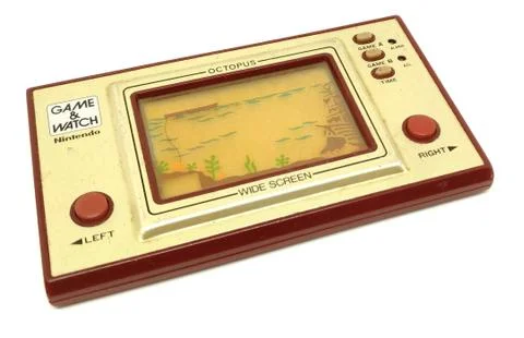 Old portable game console, Nintendo game &amp; watch octopus isolated on white ba Stock Photos