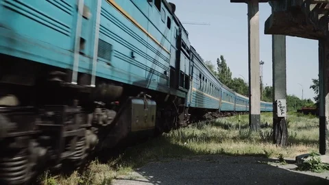 Old post soviet train arriving at an old station. Stock Footage 77155345
